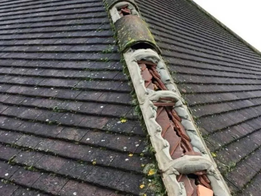 Close view of dry ridge roofing work in progress