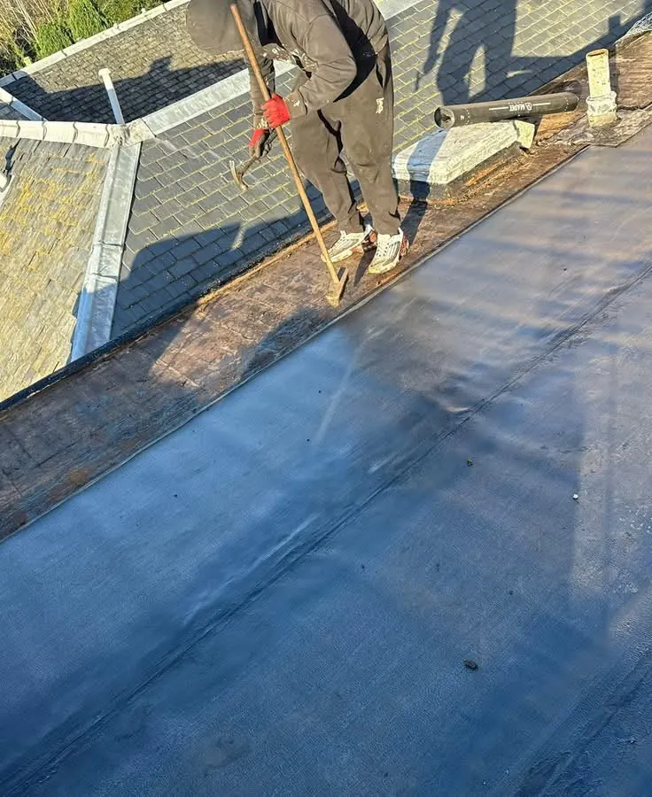 Black EPDM rubber membrane laid on a flat roof by All Fix Roofing
