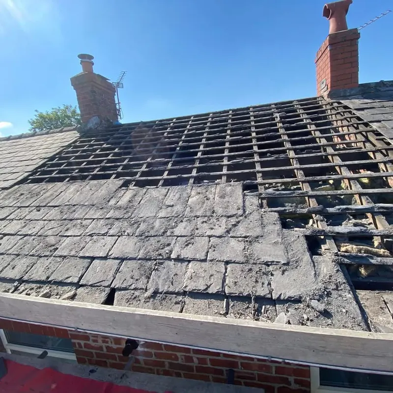 Slate roof stripped back to the battens before re-roofing